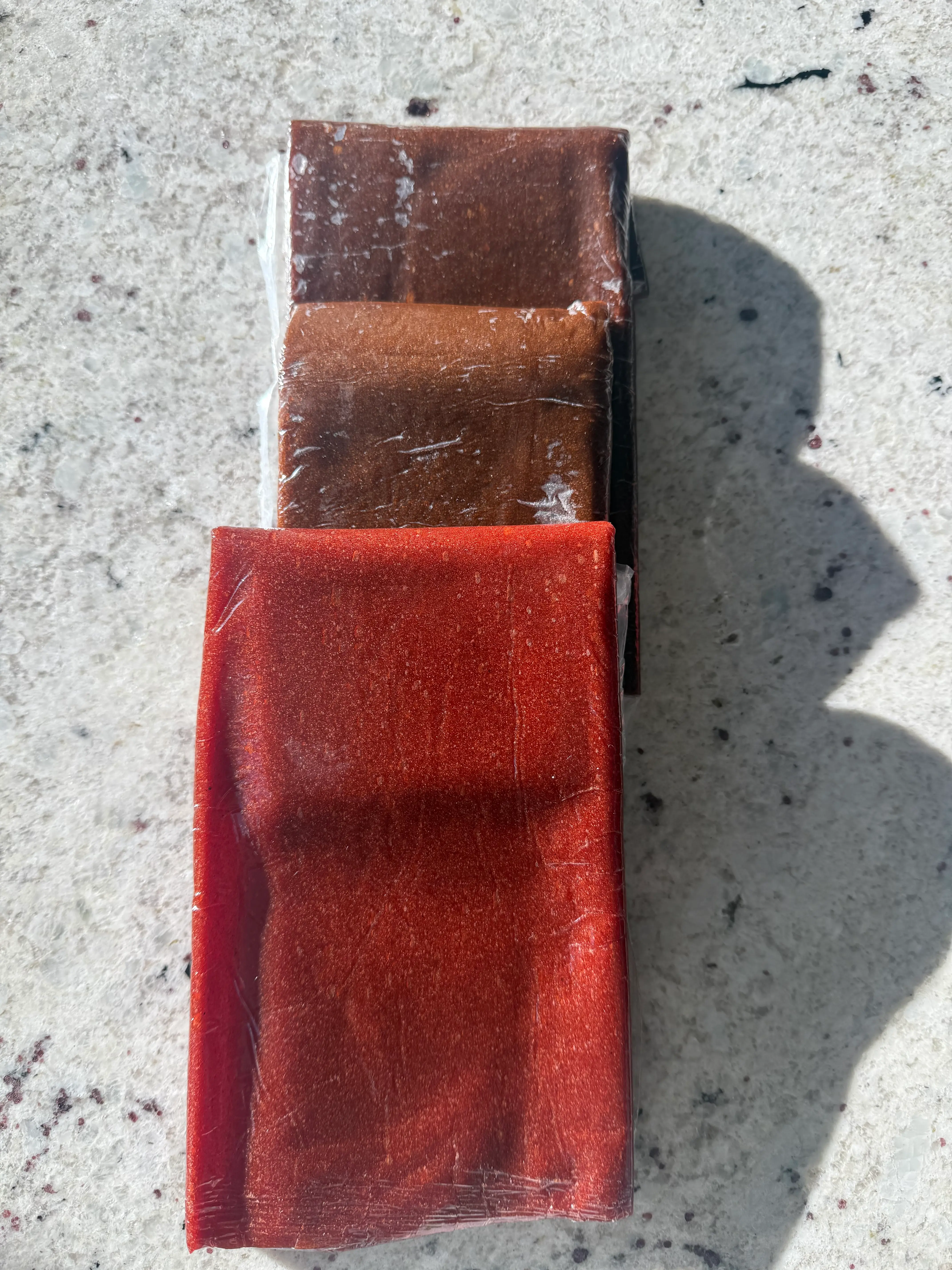  A picture the 3 fruit leathers stacked on top of each other